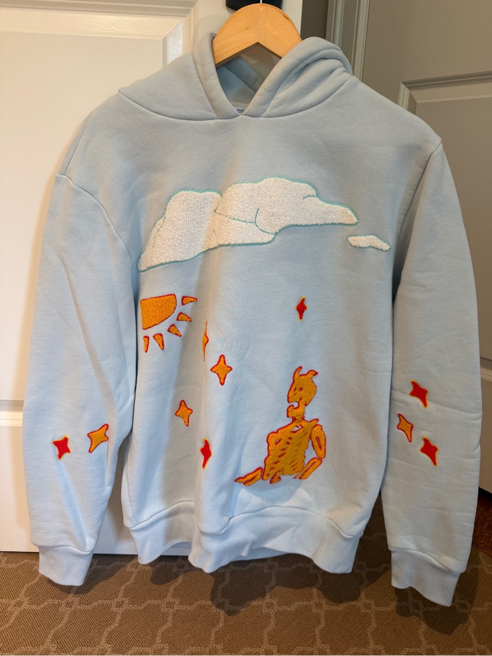 Abstract by Jules Light Blue Graphic Hoodie with Orange Embroidered Design